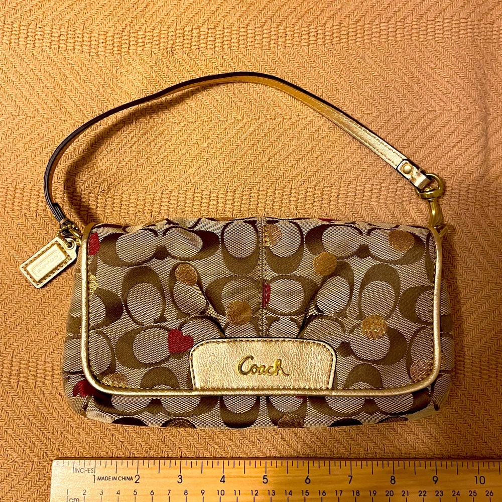 COACH Tan Signature Wristlet with Gold Accents and Red Heart Detail